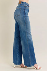 Judy Blue Full Size High Waist Tummy Control Chew Hem Destroy Wide Jeans in medium wash featuring a flattering high-rise fit, wide-leg silhouette, distressed details, raw chew hem, and slightly stretchy denim.