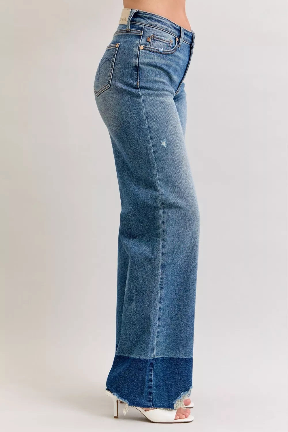 Judy Blue Raw Hem High Waist Column Straight Jeans in medium wash featuring a flattering high-rise fit, wide column straight-leg silhouette, raw hem detailing, and classic five-pocket styling for everyday wear.