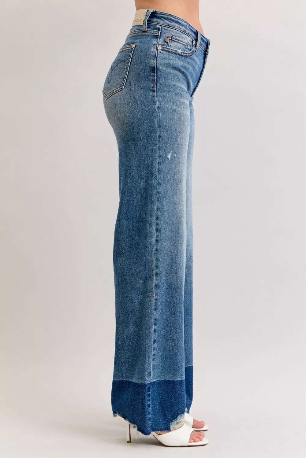 Judy Blue Raw Hem High Waist Column Straight Jeans in medium wash featuring a flattering high-rise fit, wide column straight-leg silhouette, raw hem detailing, and classic five-pocket styling for everyday wear.