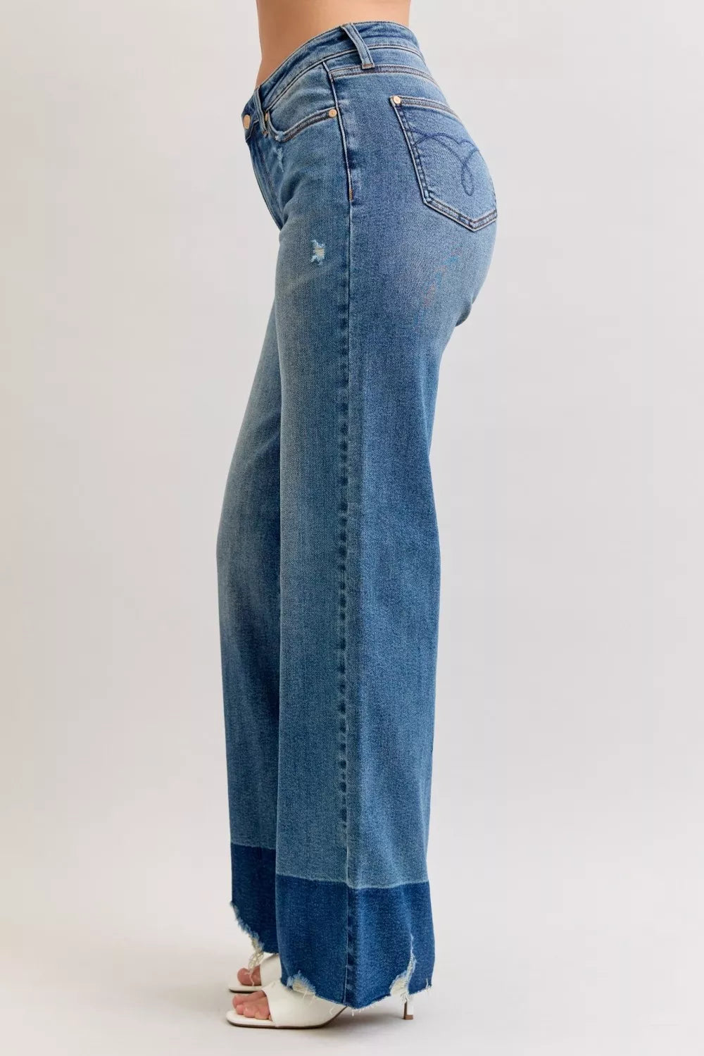 Judy Blue Raw Hem High Waist Column Straight Jeans in medium wash featuring a flattering high-rise fit, wide column straight-leg silhouette, raw hem detailing, and classic five-pocket styling for everyday wear.