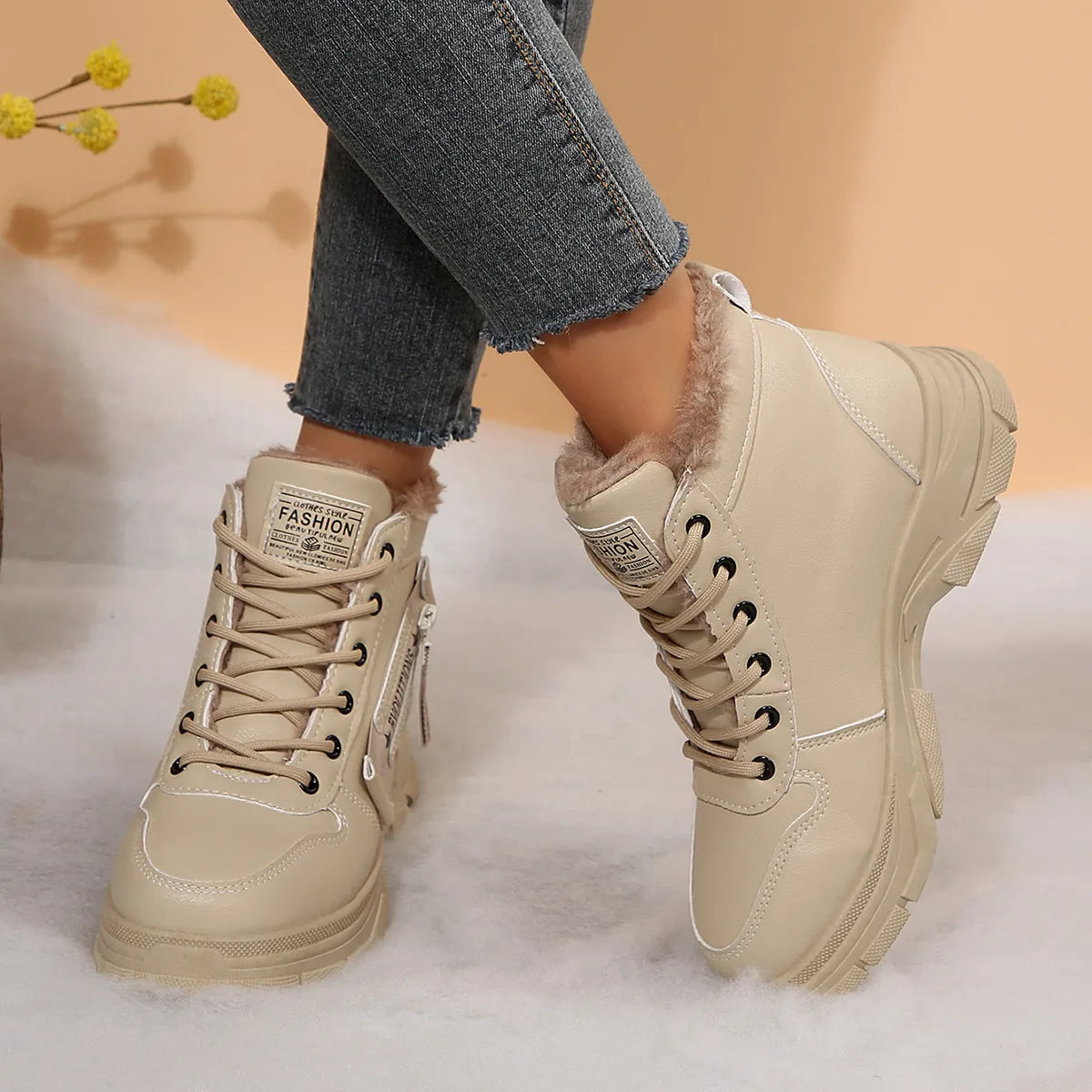 Women’s fleece-lined lace-up combat boots with chunky rubber sole and side detail, available in khaki, black and white.