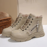 Women’s fleece-lined lace-up combat boots with chunky rubber sole and side detail, available in khaki, black and white.