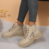 Women’s fleece-lined lace-up combat boots with chunky rubber sole and side detail, available in khaki, black and white.