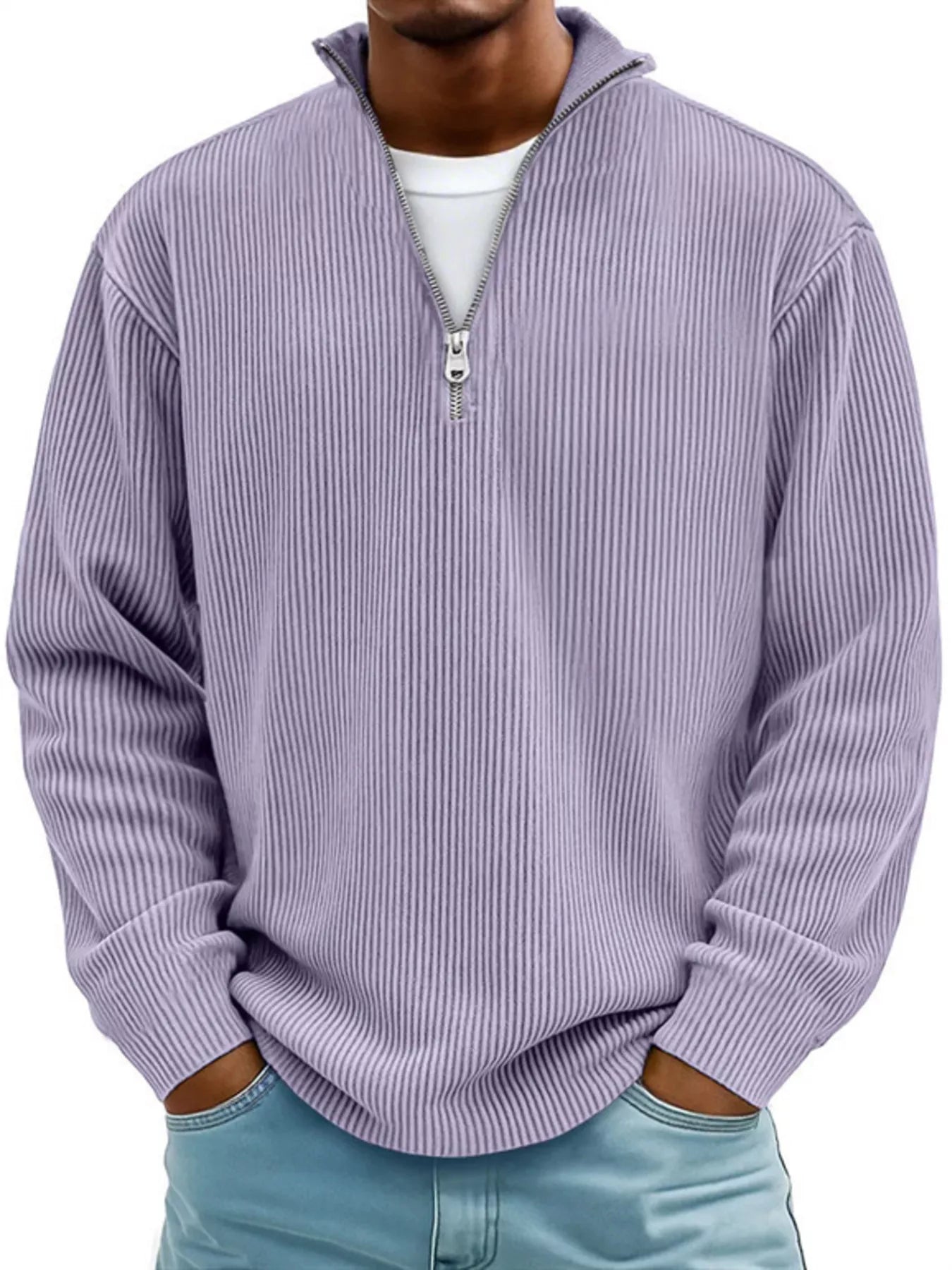Man wearing a lavender ribbed corduroy quarter zip pullover sweatshirt layered over a white shirt.