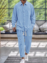 Men’s light blue button down long sleeve shirt and matching pants two-piece set with drawstring waist, available in sizes Small–2XL.