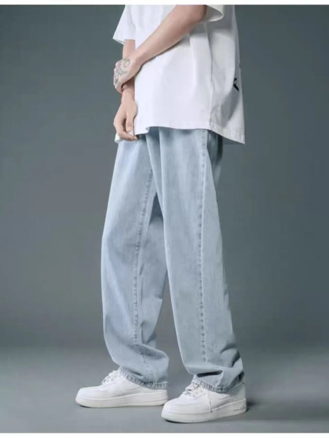 Men’s light blue washed wide leg relaxed fit jeans in extended sizes Small–3XL.