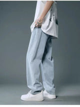 Men’s light blue washed wide leg relaxed fit jeans in extended sizes Small–3XL.