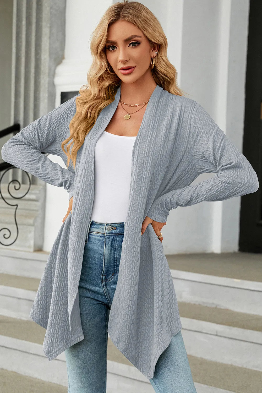 Women's Open Front Long Sleeve Cardigan in light blue layered over a white tank and blue jeans, lightweight long cardigan for fall outfits, available in nine colors at Chic Mystik Boutique.