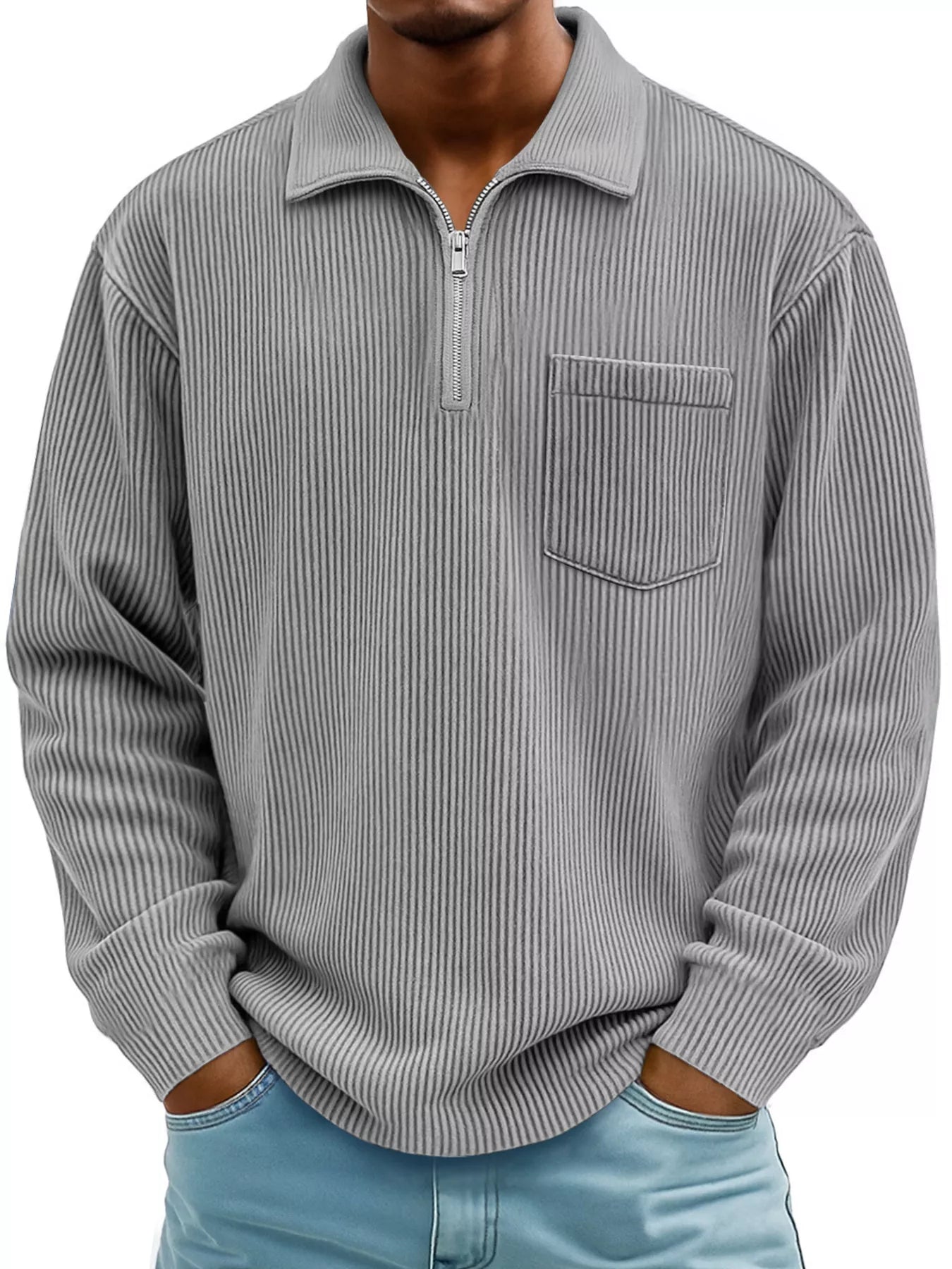 Man wearing a gray ribbed corduroy half zip long sleeve casual top with collar and chest pocket. 