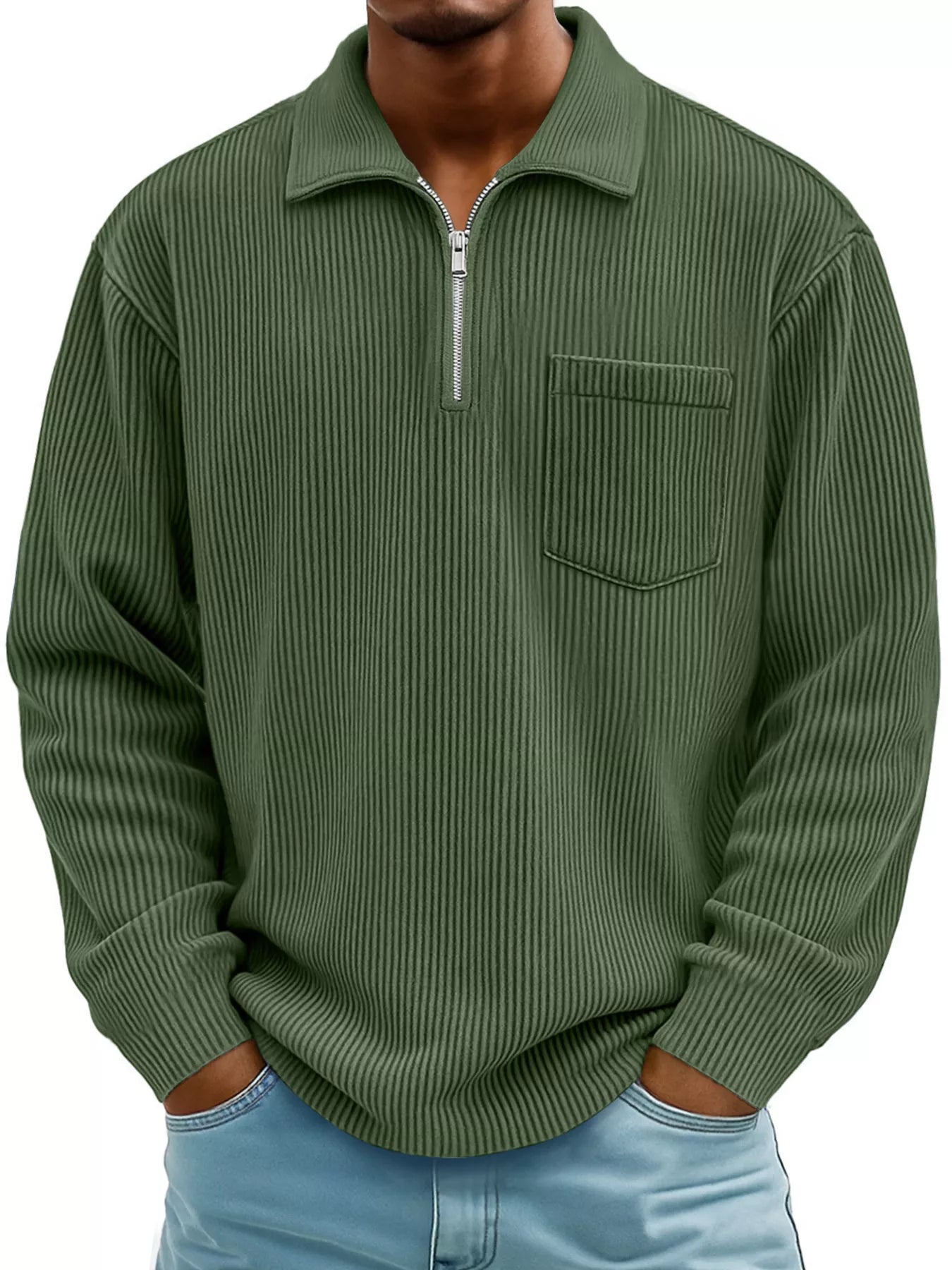 Man wearing a green ribbed corduroy half zip long sleeve casual top with collar and chest pocket.