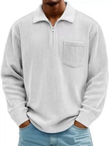 Man wearing a white ribbed corduroy half zip long sleeve casual top with collar and chest pocket.