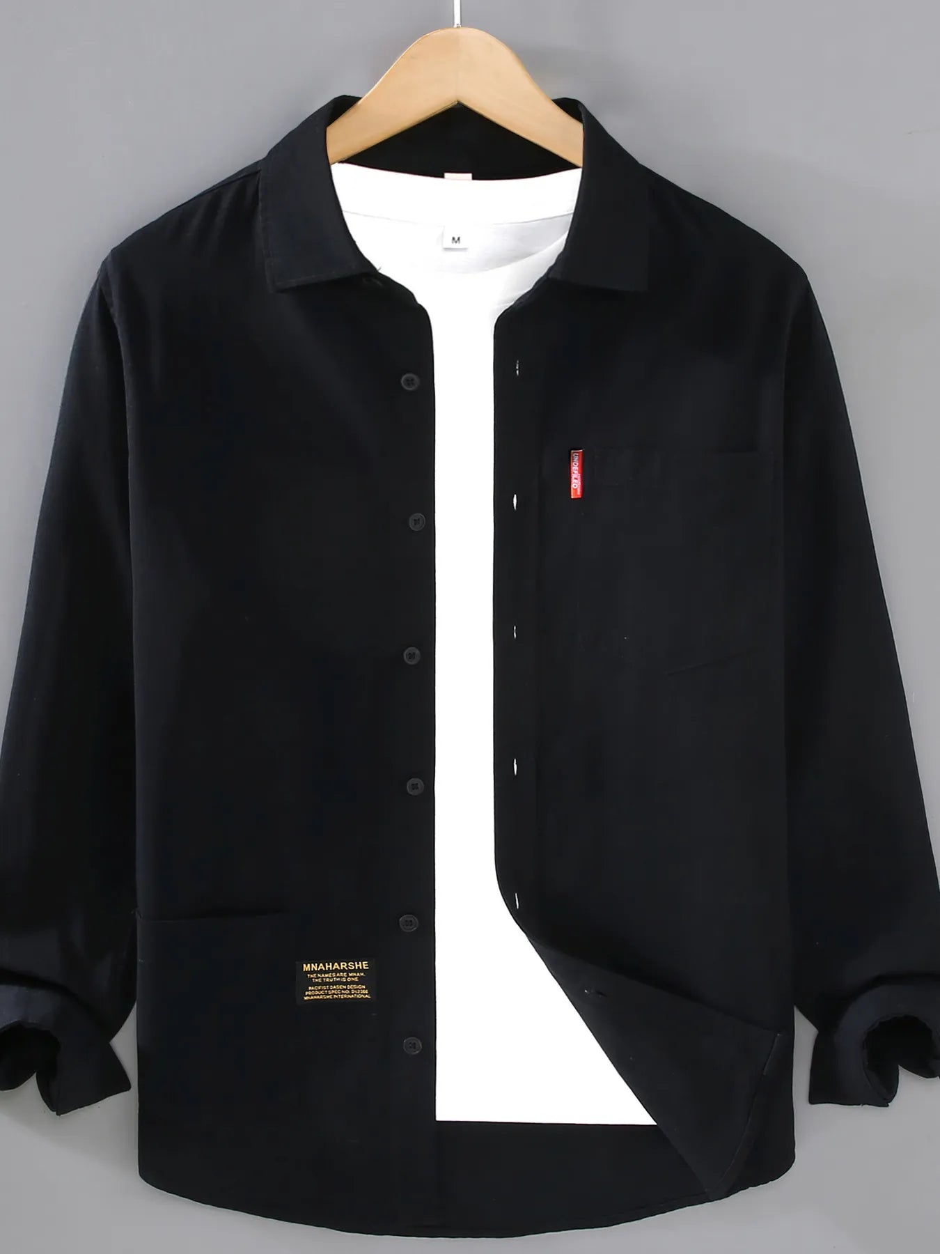 Men’s black plus size button-up long sleeve shirt with multiple pockets, shown layered over a white T-shirt.