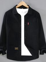 Men’s black plus size button-up long sleeve shirt with multiple pockets, shown layered over a white T-shirt.