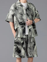 Men's plus size tie-dye two-piece outfit featuring a short sleeve button-up shirt and matching drawstring shorts in a dark navy and sage print.