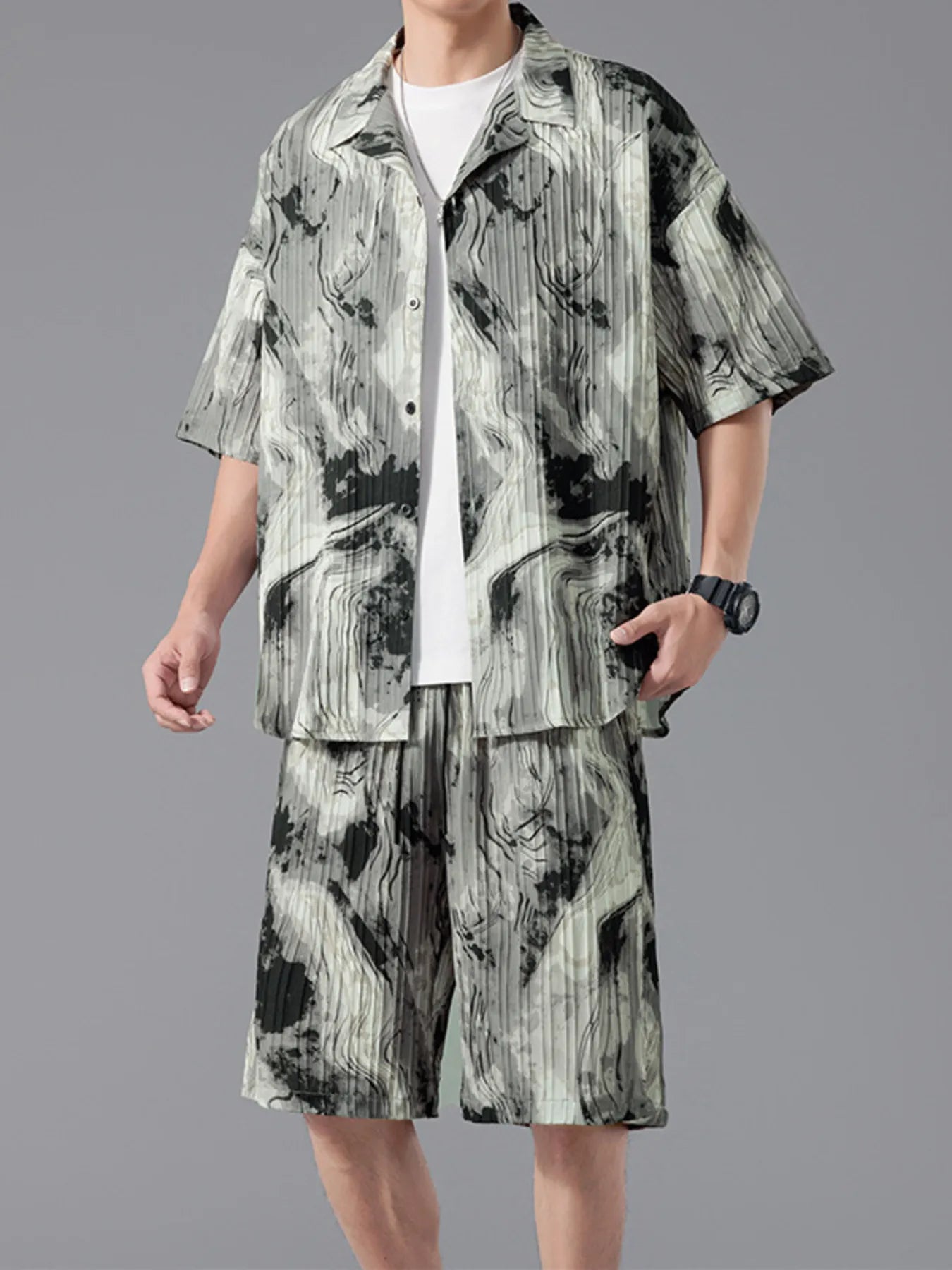 Men's plus size tie-dye two-piece outfit featuring a short sleeve button-up shirt and matching drawstring shorts in a dark navy and sage print.