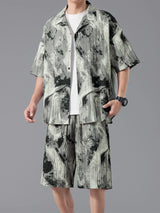 Men's plus size tie-dye two-piece outfit featuring a short sleeve button-up shirt and matching drawstring shorts in a dark navy and sage print.