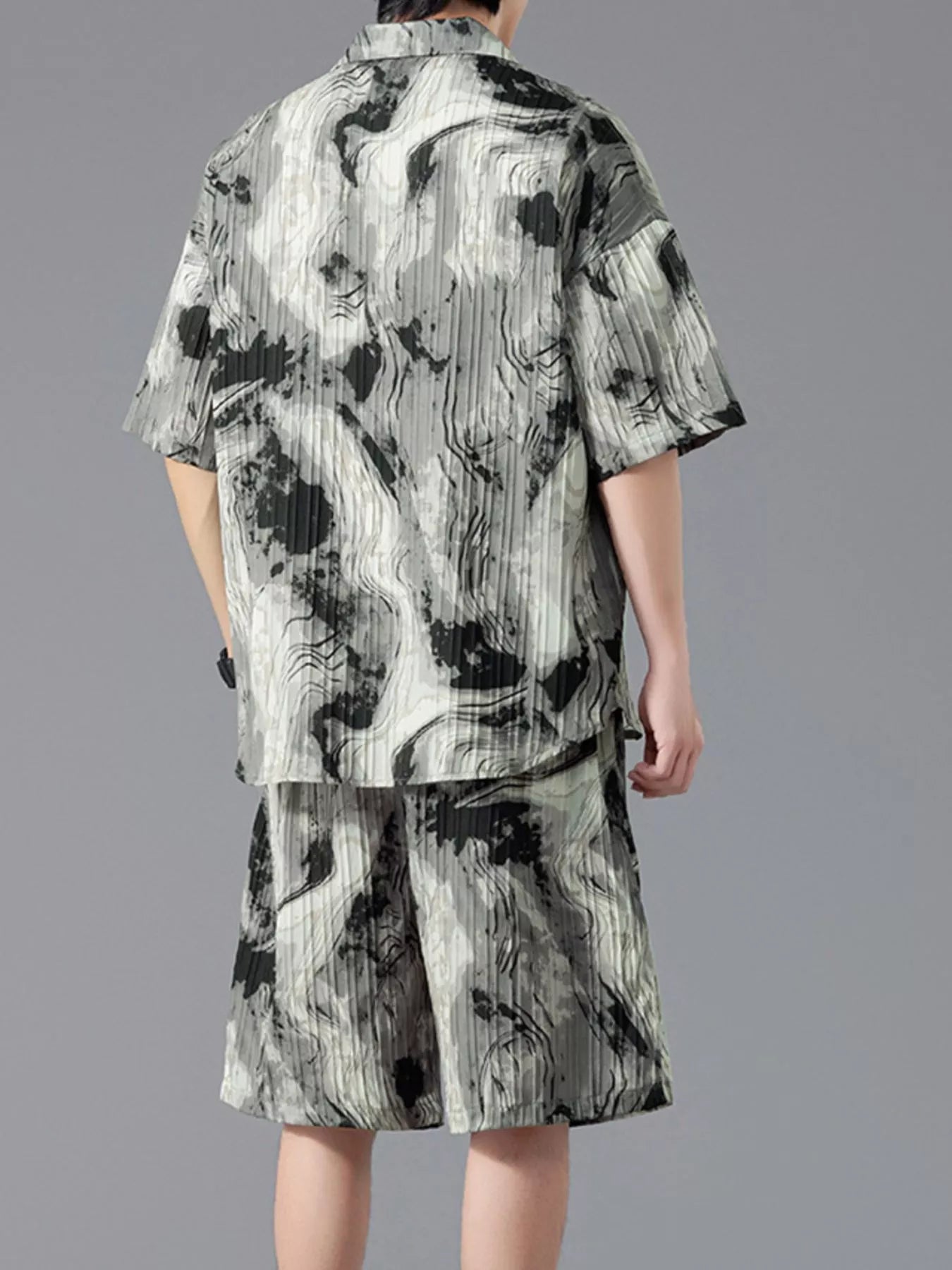 Men's plus size tie-dye two-piece outfit featuring a short sleeve button-up shirt and matching drawstring shorts in a dark navy and sage print.