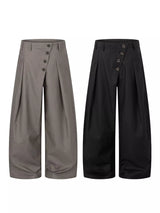 Men’s asymmetrical button wide-leg pants in coffee and black with pleated front and statement button detail.