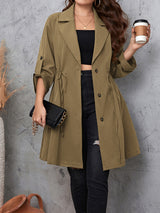 Woman wearing the Honey Plus Size Lapel Collar Drawstring Roll-Tab Sleeve Trench Coat in mocha with black denim and a black top, lightweight plus size fall trench coat from Chic Mystik Boutique.
