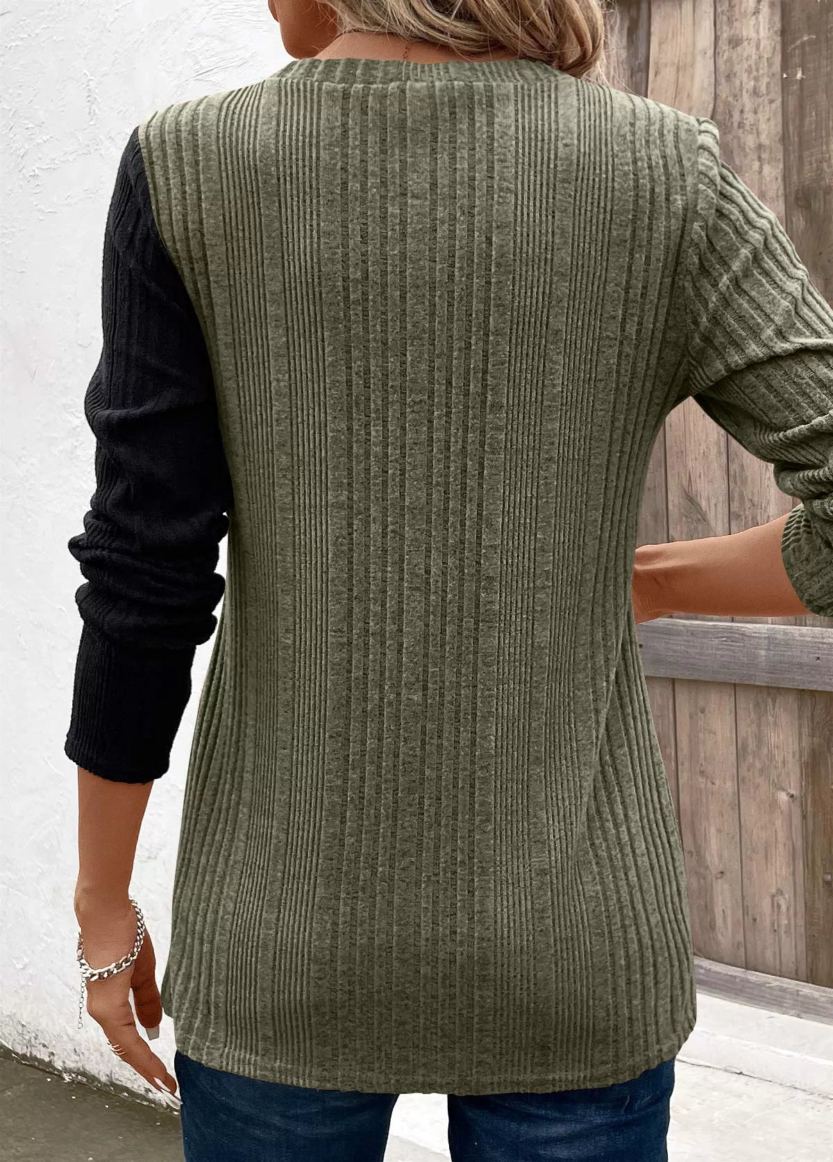 Women’s moss green and black color block ribbed knit long sleeve top with decorative side buttons and slit detail, available in sizes Small–2XL.