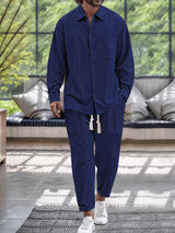 Men’s navy button down long sleeve shirt and matching pants two-piece set with drawstring waist, available in sizes Small–2XL.