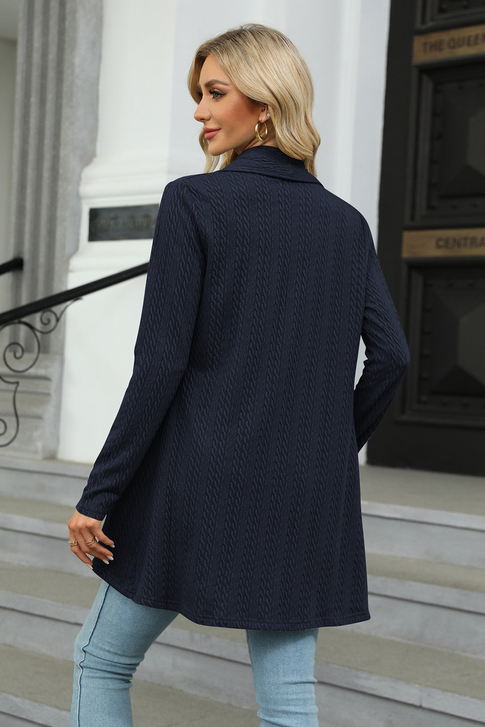Women's dark navy colored open front long sleeve cardigan with a flattering high-low hem. Lightweight boutique cardigan perfect for layering over dresses, tanks, or jeans for effortless fall style.