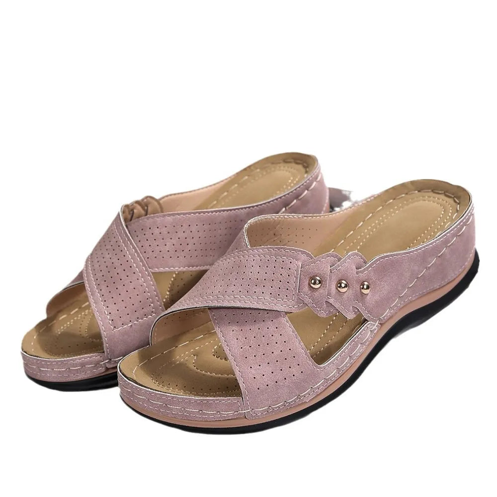 Pair of pink sandals on a white background