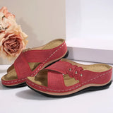 Red sandals with a beige insole on a light background