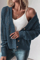 Women's peacock blue openwork button up cardigan with textured knit detailing and long sleeves.