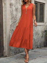 Woman wearing the Ivy Lane decorative button sleeveless dress with a notched neckline and a flattering silhouette.
