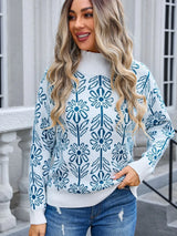 Women’s peacock blue and white floral turtleneck long sleeve sweater with allover flower pattern.