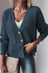 Women's peacock blue openwork button up cardigan with textured knit detailing and long sleeves.
