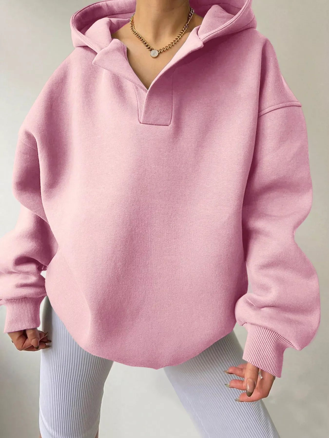 Women's oversized dropped shoulder hoodie sweatshirt in pink with long sleeves and relaxed fit, perfect for casual fall outfits, available in 11 colors and sizes Small–2XL.