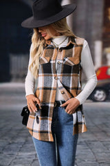 Woman wearing a camel plaid button-up vest coat layered over a white turtleneck with blue jeans and gold jewelry for a cozy fall outfit.
