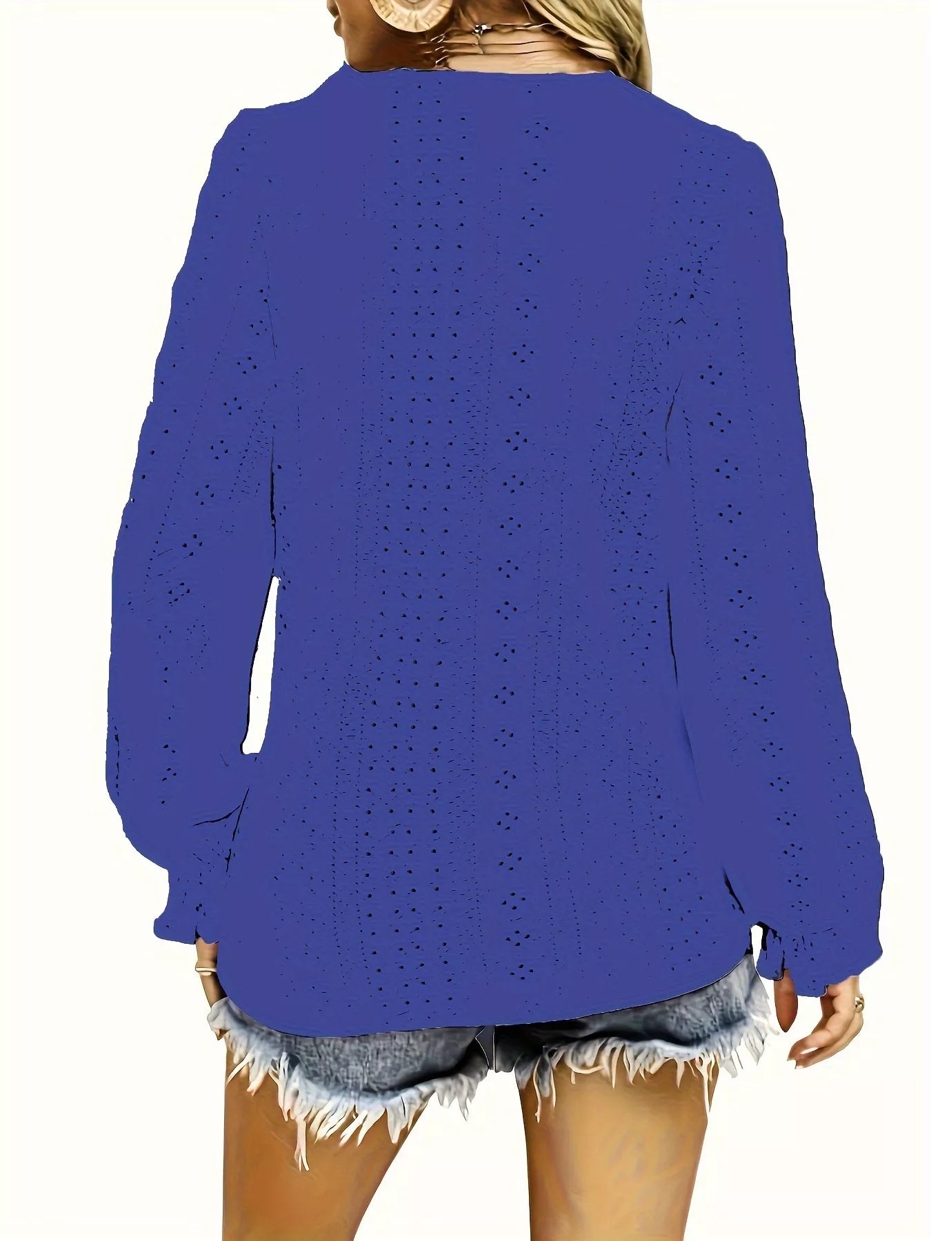 Blue V-neck blouse worn by a person on a white background showing back of shirt