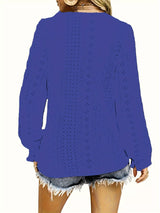 Blue V-neck blouse worn by a person on a white background showing back of shirt