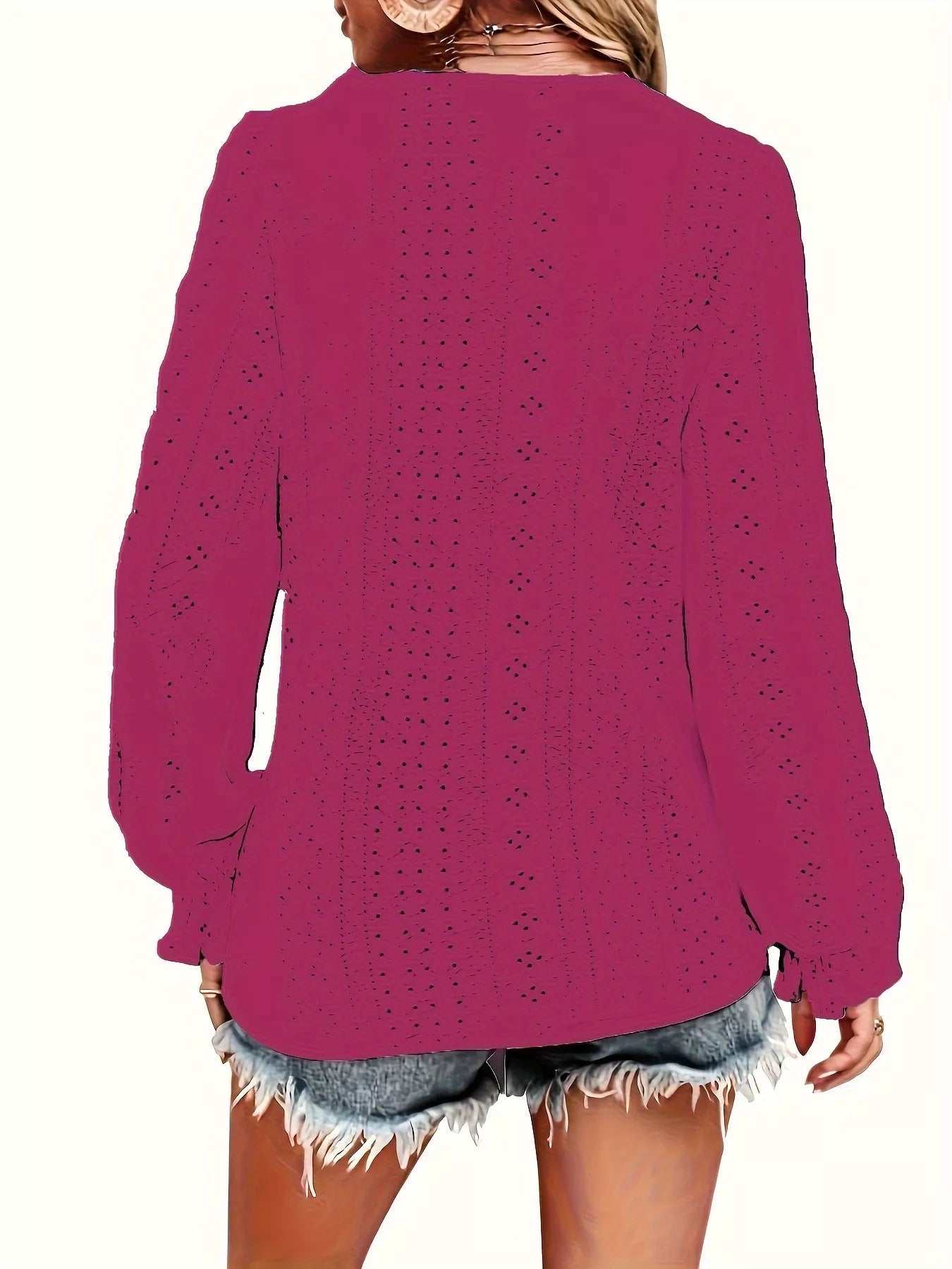 Rose red blouse worn by a person on a white background showing back of blouse