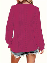 Rose red blouse worn by a person on a white background showing back of blouse