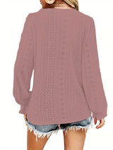 Rouge Color blouse with eyelet details worn by a person on a white background showing the back of blouse