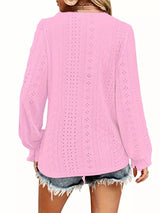 Pink crochet blouse worn by a person on a white background showing back of blouse