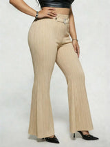 Model wearing tan plus-size high-waisted flare pants styled with pointed-toe heels for an elegant and sophisticated look.