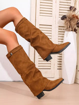 Woman wearing brown point toe block heel boots featuring a classic Western-inspired silhouette with a comfortable low heel, perfect for pairing with fall dresses, denim, and cozy sweaters.