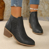 Women’s point toe block heel ankle boots with perforated side detail in black.
