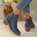 Women’s point toe block heel ankle boots with perforated side detail in blue.