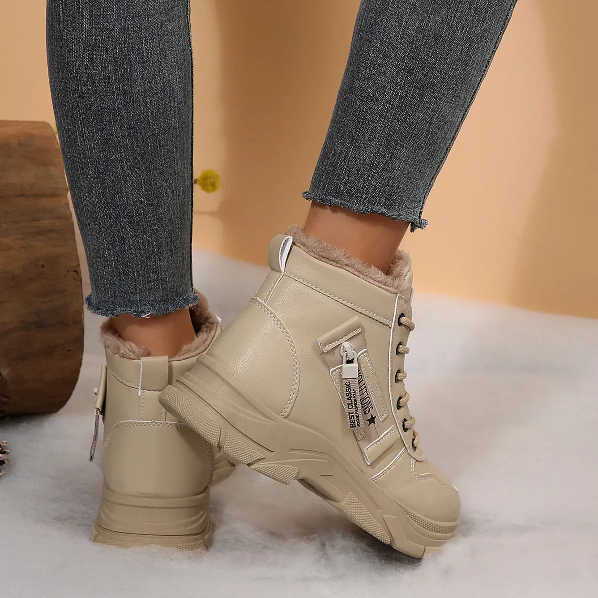 Women’s fleece-lined lace-up combat boots with chunky rubber sole and side detail, available in khaki, black and white.