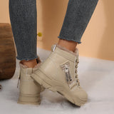 Women’s fleece-lined lace-up combat boots with chunky rubber sole and side detail, available in khaki, black and white.