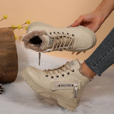 Women’s fleece-lined lace-up combat boots with chunky rubber sole and side detail, available in khaki, black and white.