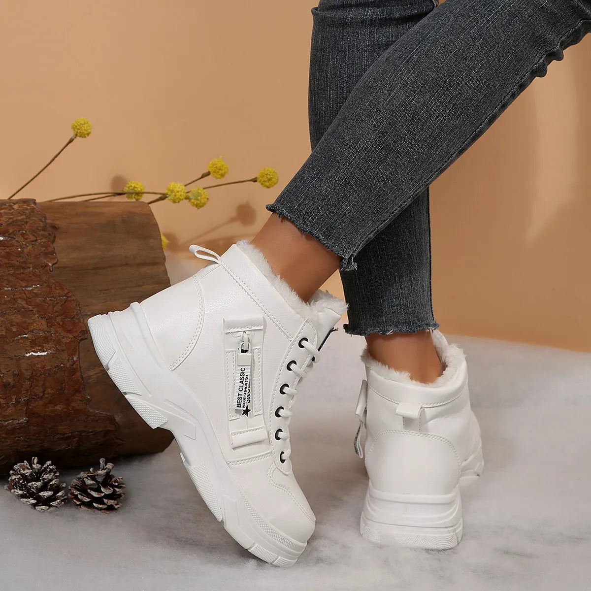Women’s fleece-lined lace-up combat boots with chunky rubber sole and side detail, available in khaki, black and white.