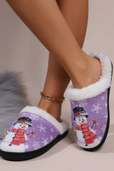 Heliotrope purple snowman slippers with white faux fur lining, festive snowflakes, smiling snowman print, and round toe design.