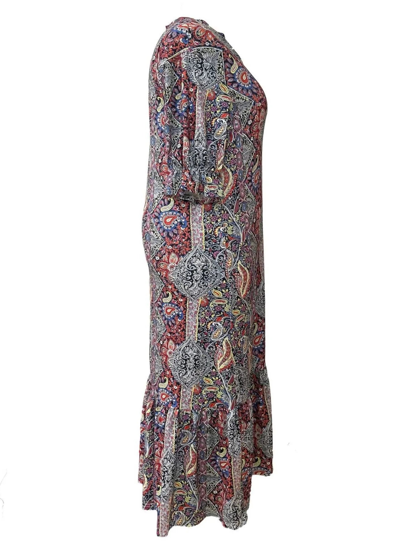 Woman wearing a red bohemian paisley print midi dress with three-quarter sleeves and ruffled hem.